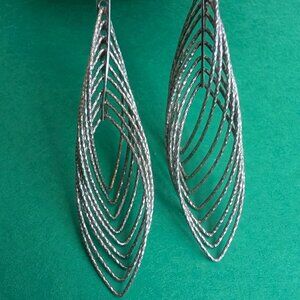 Silver interlocking hoop earrings with textured surface 2"